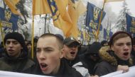 Ukrainian far-right groups attend a rally demanding to set martial law in the country and to cut diplomatic relations with Russia, after Russian navy seized three Ukrainian ships off near the Crimea, in front of the Ukrainian Parliament in Kiev, Ukraine, 