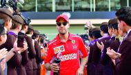 Ferrari's German driver Sebastian Vettel walks ahead of the Abu Dhabi Formula One Grand Prix at the Yas Marina circuit on November 25, 2018, in Abu Dhabi. AFP / Andrej Isakovic