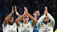 Real Madrid's Brazilian defender Marcelo, Real Madrid's Spanish midfielder Lucas Vazquez, Real Madrid's Belgian goalkeeper Thibaut Courtois (Rear) and Real Madrid's Spanish defender Dani Carvajal acknowledge the public at the end of the UEFA Champions Lea