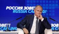 Russian President Vladimir Putin attends a session of the VTB Capital Investment Forum 