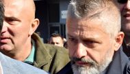 In this file photo taken on October 09, 2017 Naser Oric, wartime commander of Bosnian Muslim forces in the area of Srebrenica and Bratunac, leaves court in Sarajevo on October 9, 2017. / AFP / ELVIS BARUKCIC 