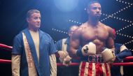 A still of the actors Michel B. Jordan (R) and Sylvester Stallone from the movie Creed II.