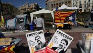 FILE PHOTO: Banners with the photos of jailed Catalan pro-independence leaders Jordi Sanchez and Jordi Cuixart are displayed at a protest rally in Barcelona, Spain March 28, 2018. REUTERS/Susana Vera