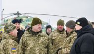 Ukraine's President Petro Poroshenko (2nd L), Defence Minister Stepan Poltorak (L) and Secretary of the National Security and Defence Council Oleksander Turchinov visit an airbase of the 40th Tactical Aviation Brigade of the Ukrainian Armed Forces in Vasy