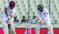 West Indies' Kieran Powell (L) is bowled out during the second day of the second Test cricket match between Bangladesh and West Indies in Dhaka on December 1, 2018. AFP / Salahuddin Ahmed 