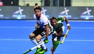 German player Benedikt Furk (L) and Pakistan player Umar Bhutta (R) fight for the ball during the field hockey group stage match between Germany and Pakistan at the 2018 Hockey World Cup in Bhubaneswar on December 1, 2018. AFP / Asit Kumar

