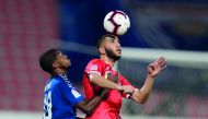 Al Arabi and Al Kharaitiyat players vie for ball possession during their QNB Stars League Round-14 match played at the Al Arabi Stadium yesterday.