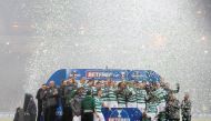 Celtic players celebrate with the trophy after winning the final REUTERS/Russell Cheyne