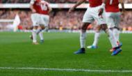 A banana thrown from the crowd is seen at the side of the pitch as Arsenal's Gabonese striker Pierre-Emerick Aubameyang at the Emirates Stadium in London on December 2, 2018. / AFP / IKIMAGES / Ian KINGTON 