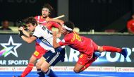 France's Jean Baptiste Forgues (L) fights for the ball with Spain's Enrique Gonzalez during the field hockey group stage match between France and Spain at the 2018 Hockey World in Bhubaneswar on December 3, 2018. AFP / Dibyangshu Sarkar
