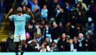 Manchester City's English midfielder Raheem Sterling celebrates scoring their second goal for 2-1 during the English Premier League football match between Manchester City and Bournemouth at the Etihad Stadium in Manchester, north west England, on December