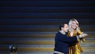 Olympique Lyonnais' Norwegian forward Ada Hegerberg (R) dances with French DJ and producer Martin Solveig after receiving the 2018 FIFA Women's Ballon d'Or award for best player of the year during the 2018 FIFA Ballon d'Or award ceremony at the Grand Pala