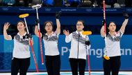 File photo of Kim Eun-jung, Kim Kyeong-ae, Kim Seon-yeong and Kim Yeong-mi of South Korea celebrate beating Sweden, February 19, 2018. REUTERS/Toby Melville/File Photo