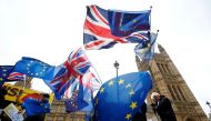 FILE PHOTO: Demonstrators protest against Brexit outside the Houses of Parliament in London, Britain, November 28, 2018. REUTERS/Henry Nicholls/File Photo