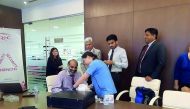 QIC’s staff undergoing a medical check-up. 