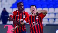 Al Rayyan skipper Rodrigo Tabata (right) celebrates after scoring their fourth goal against Al Kharaitiyat yesterday. 