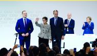 Annegret Kramp-Karrenbauer (C) greets the crowd as she is flanked by candidates for the new leadership of the German Christian Democrats Friedrich Merz (R) and Jens Spahn (L) after elected as new party leader during the 31st Party Congress of the Christia