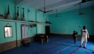 Loudspeakers are seen kept inside a mosque as a Muslim man talks to a reporter in Nayabans village in Bulandshahr district, Uttar Pradesh, India December 5, 2018. Reuters/Adnan Abidi 