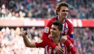 Atletico Madrid's Spanish midfielder Rodrigo celebrates with teammate Atletico Madrid's French forward Antoine Griezmann after scoring a goal during the Spanish league football match between Club Atletico de Madrid and Deportivo Alaves at the Wanda Metrop