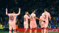 Barcelona's Argentinian forward Lionel Messi (L) celebrates after scoring during the Spanish league football match RCD Espanyol against FC Barcelona at the RCDE Stadium in Cornella de Llobregat on December 8, 2018. / AFP / PAU BARRENA
