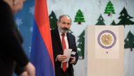 Armenia's Prime minister Nikol Pashinyan is about to cast his ballot during early parliamentary elections in Yerevan on December 9, 2018. / AFP / Karen MINASYAN