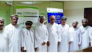 The officials and dignitaries posing for a group picture after the signing ceremony in Muscat.
