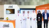 Senior officials of ASTAD posing for a group picture at the company’s pavilion at the Made in Qatar Expo, which concluded in Muscat recently.