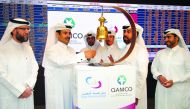H E Saad bin Sherida Al Kaabi (second left), Minister of State for Energy Affairs and President and CEO of Qatar Petroleum; Rashid bin Ali Al Mansoori (second right), Qatar Exchange CEO; and Abdulrahman Ahmad Al Shaibi (left), Chairman, Board of Directors
