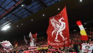 Liverpool fans hold up flags and banners in the crowd ahead of the English Premier League football match between Liverpool and Manchester United at Anfield in Liverpool, north west England on December 16, 2018. AFP / Paul ELLIS