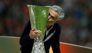 :FILE PHOTO: Manchester United manager Jose Mourinho celebrates winning the Europa League with the trophy Reuters / Andrew Couldridge/File Photo