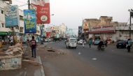 A picture taken on December 17, 2018 shows people driving in a market in the Huthi-held Red Sea port city of Hodeida. / AFP