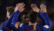  Barcelona's Argentinian forward Lionel Messi celebrates with Barcelona's French forward Ousmane Dembele scoring a goal during the Spanish League football match between FC Barcelona and RC Celta de Vigo at the Camp Nou stadium in Barcelona on Decemeber 22