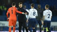 Tottenham Hotspur's Argentinian head coach Mauricio Pochettino (2L) celebrates with Tottenham Hotspur's French goalkeeper Hugo Lloris (L) and Tottenham Hotspur's English midfielder Harry Winks (2R) at the end of the English Premier League football match b