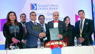 Dr R Seetharaman (third right), Chief Executive Officer of Doha Bank, shaking hands with Janak Sharma Poudyal, CEO of Global IME Bank, after signing the agreement in Kathmandu, Nepal, recently. 