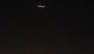 A streak of light in the sky of the Syrian capital Damascus. Syrian air defences opened fire on 