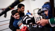 Jorge Pina, 42 years old, blind and paralympic marathoner, teaches boxing to autistic children at Olivais school in Lisbon on January 24, 2018. AFP / PATRICIA DE MELO MOREIRA 