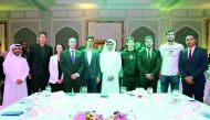 Nasser Al Khelaifi, President of the Qatar Tennis Federation, and Alistair Routledge, President and General Manager for ExxonMobil Qatar, are seen with World No. 1 Austria, Novak Djokovic of Serbia, Stan Wawrinka of Switzerland and other players and offic
