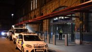 Police officers stand near a cordon at Manchester Victoria Station, in Manchester on January 1, 2019, following a stabbing on December 31, 2018. AFP / Paul Ellis 
