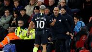 Manchester City's Sergio Aguero shakes hands with manager Pep Guardiola after being substituted. Reuters/John Sibley