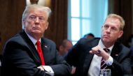 U.S. President Donald Trump listens next to Acting U.S. Defense Secretary Patrick Shanahan during a Cabinet meeting on day 12 of the partial U.S. government shutdown at the White House in Washington, U.S., January 2, 2019. REUTERS/Jim Young