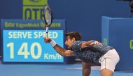 Novak Djokovic of Serbia returns the ball to Marton Fucsovics of Hungary during their Qatar ExxonMobil Open match played at the Khalifa Tennis and Squash Complex in Doha yesterday. (Picture: Salim Matramkot/The Peninsula)