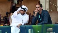 Paris Saint-Germain FC’s (PSG) and Qatar Tennis Federation (QTF) President Nasser bin Ghanim Al Khelaifi (left) gestures as he speaks to PSG’s manager Thomas Tuchel, while watching the ATP Qatar ExxonMobil Open tennis match between Stan Wawrinka of Switze