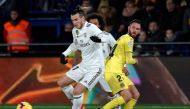 Villarreal's Mexican defender Miguel Layun (R) vies with Real Madrid's Welsh forward Gareth Bale during the Spanish League football match between Villarreal CF and Real Madrid CF at La Ceramica stadium in Vila-real on January 3, 2019. / AFP / JOSE JORDAN