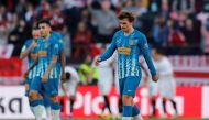 Atletico Madrid's Antoine Griezmann and team mates look dejected after conceding their first goal scored by Sevilla's Wissam Ben Yedder (not pictured) REUTERS/Marcelo Del Pozo