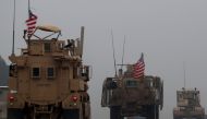 (FILES) In this file photo taken on December 30, 2018, shows a line of US military vehicles in Syria's northern city of Manbij. AFP / Delil SOULEIMAN