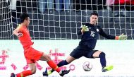 Philippines’ Michael Falkesgaard makes a save from China’s Wu Lei during their AFC Asian Cup Group C at Mohammed bin Zayed Stadium in Abu Dhabi, yesterday.  Reuters/Suhaib Salem 