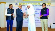 Indian Ambassador P Kumaran presenting a plaque of appreciation to Qatar-based singer Ahmed Abdulrahim.