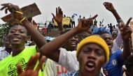 Supporters of opposition presidential candidate in the Democratic Republic of Congo Martin Fayulu sing in Kinshasa on January 12, 2019, as presidential candidate Martin Fayulu filed his appeal to impose a recount of the votes in the presidential election 