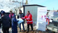 The representatives of QRCS are providing humanitarian aid to storm-affected Syrian refugees in Lebanon.