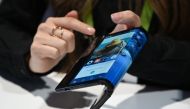 The folding and capabilities of the Royole FlexiPai tablet and phone are demonstrated at the Royole booth at CES 2019 consumer electronics show, January 8, 2019 in Las Vegas, Nevada. AFP / Robyn Beck